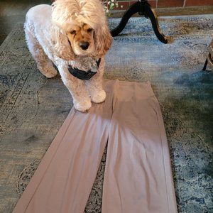 Athleta athleisure full leg, flared slacks in tan with zipper pockets. Size 2